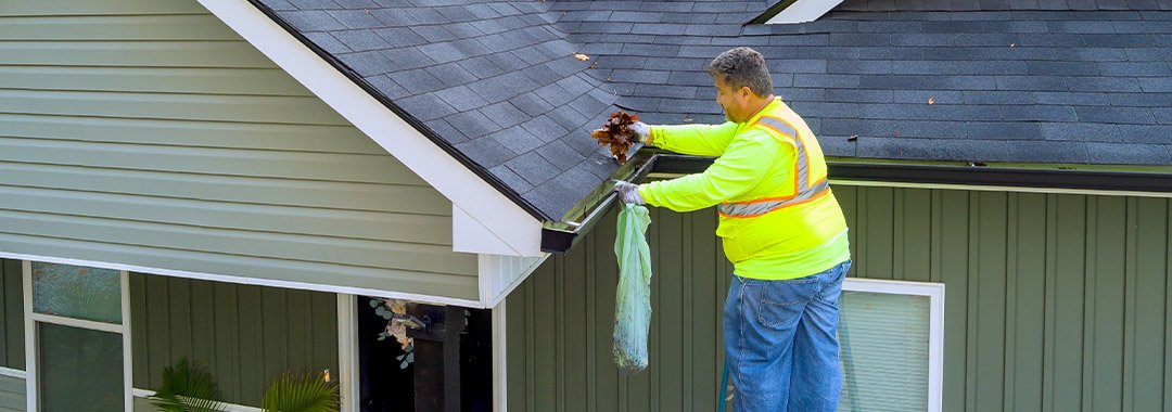 image of working completing a gutter cleaning service